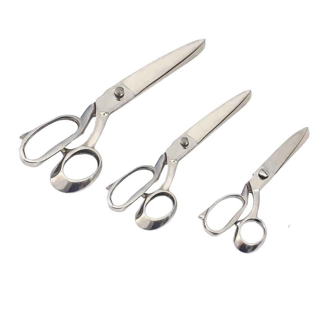 "Professional dressmaking shears on white background"