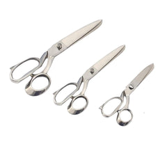 "Professional dressmaking shears on white background"